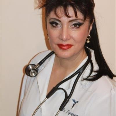 Portrait of Dr. Irina Ilyayeva, MD, pediatrician, wearing a white coat and stethoscope